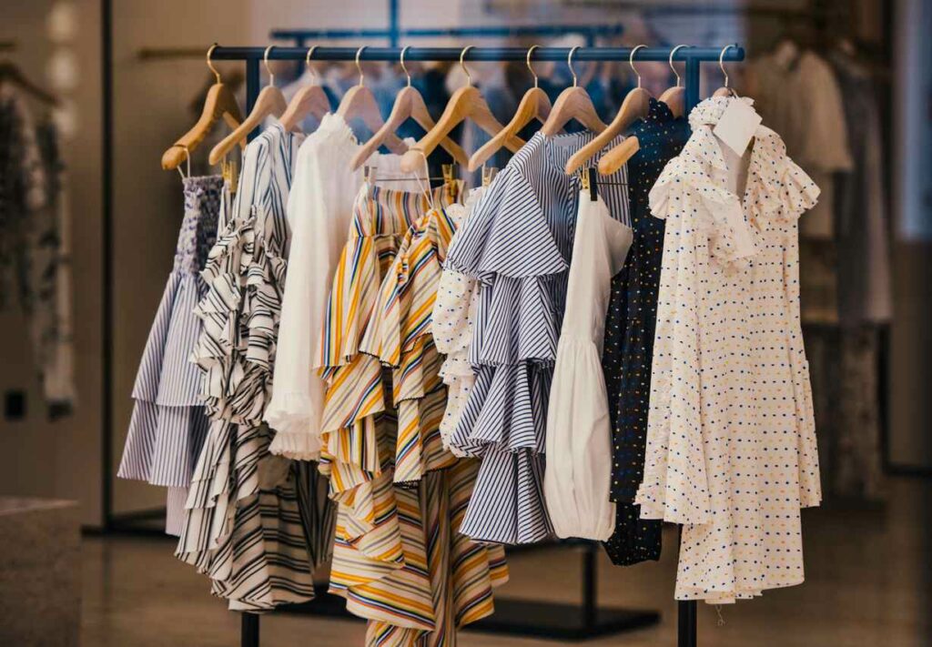 Fashionable dresses hanging from a garment rack