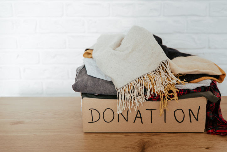 A stack of clothes inside a donation box