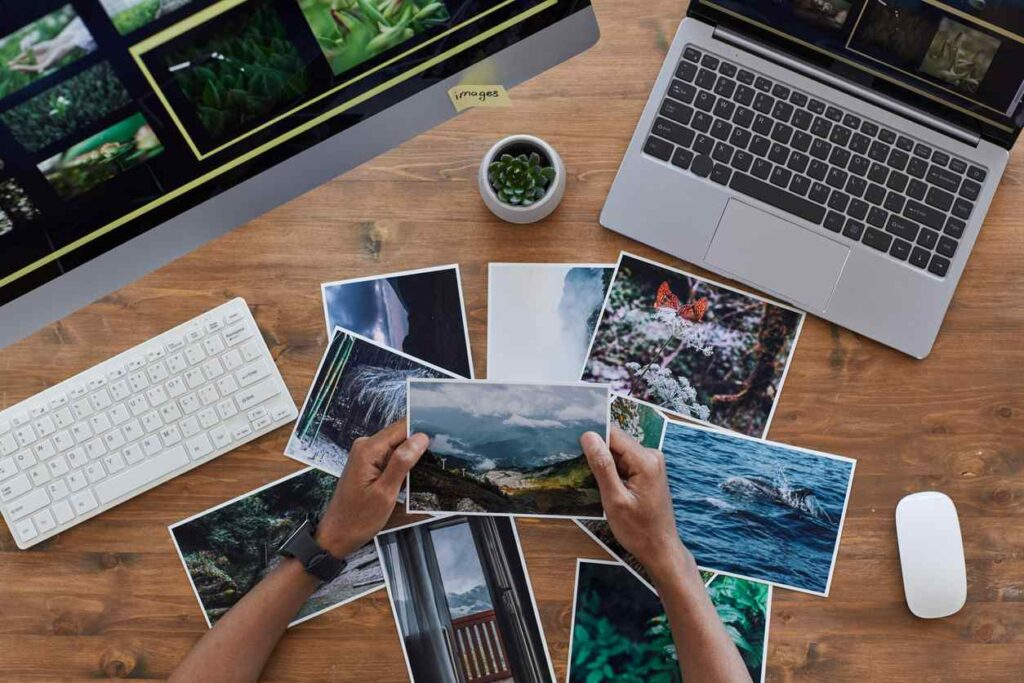 A desk full of printed photos
