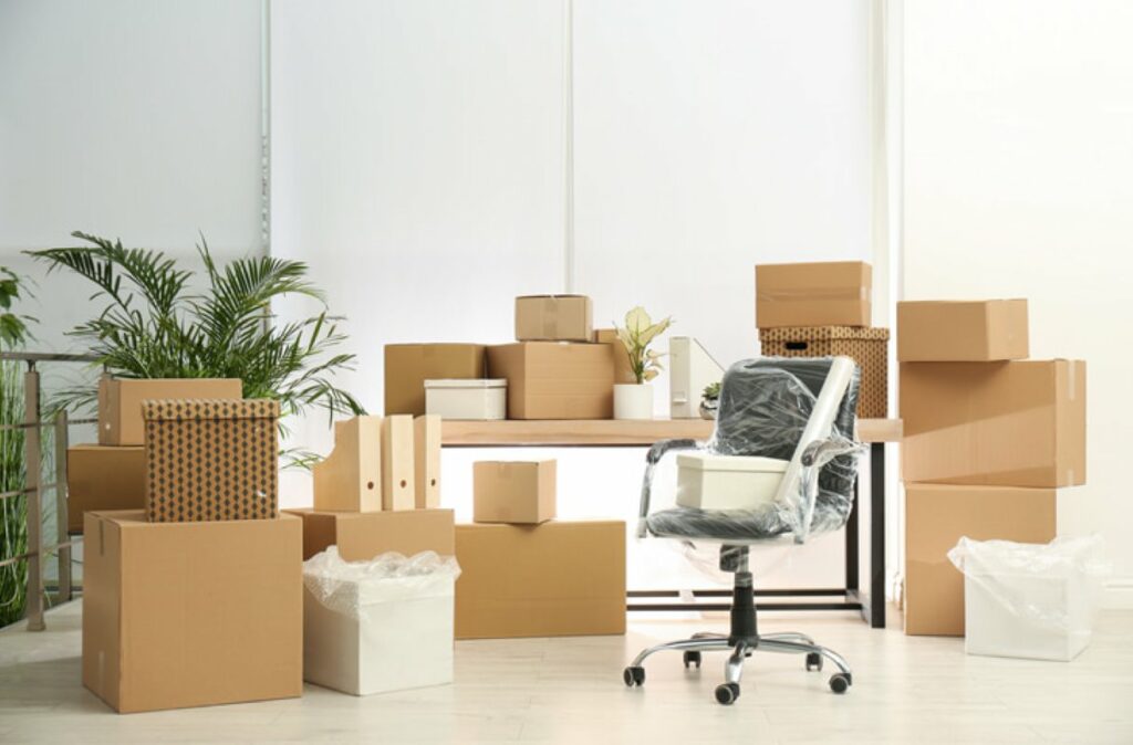 A room full of storage items in boxes and protective wrap