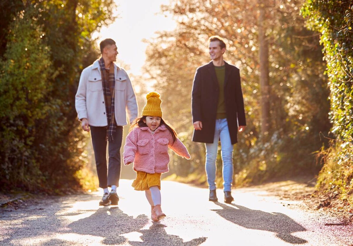 A happy family going on a walk in the fall.