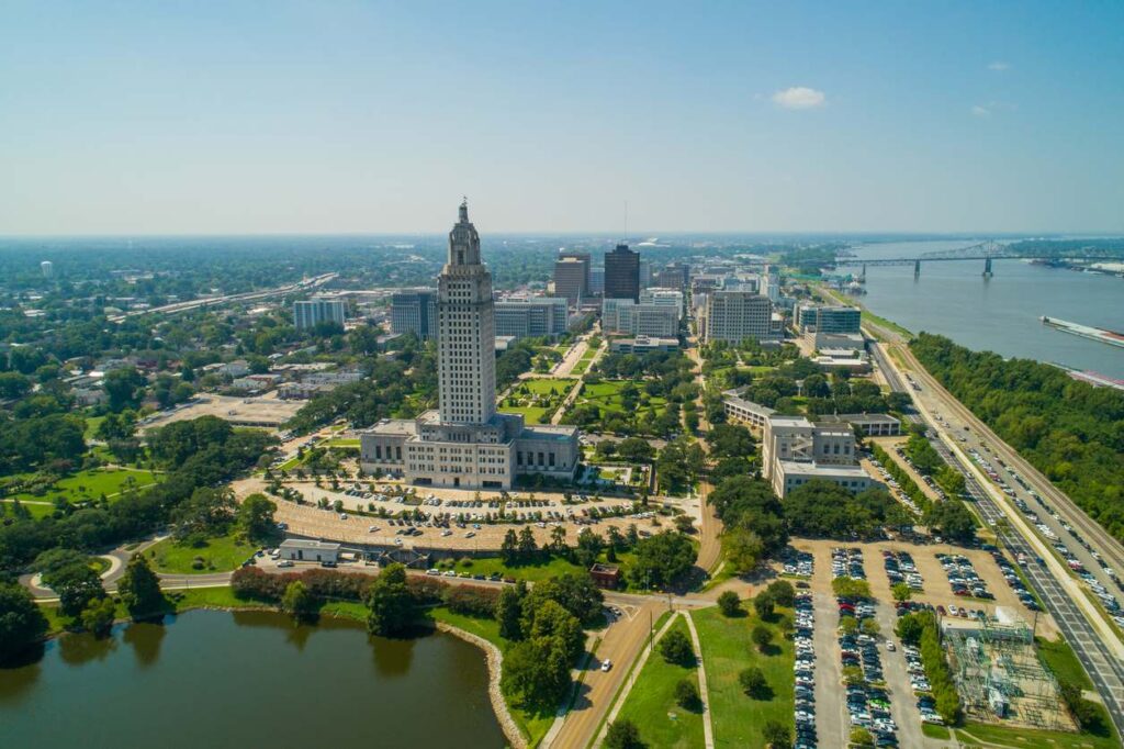 Downtown Baton Rouge with the Louisiana State Capitol building, parks, and the Mississippi River. 